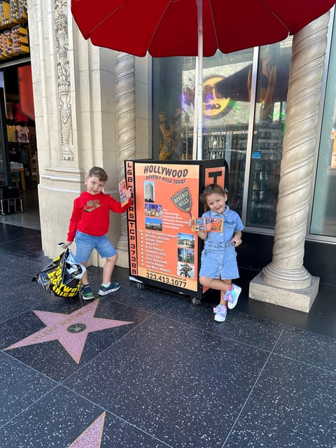 Los Angeles: Hollywood and Beverly Hills Open-Top Bus Tour - Boarding at the Hollywood Experience and Finding the Red Umbrella